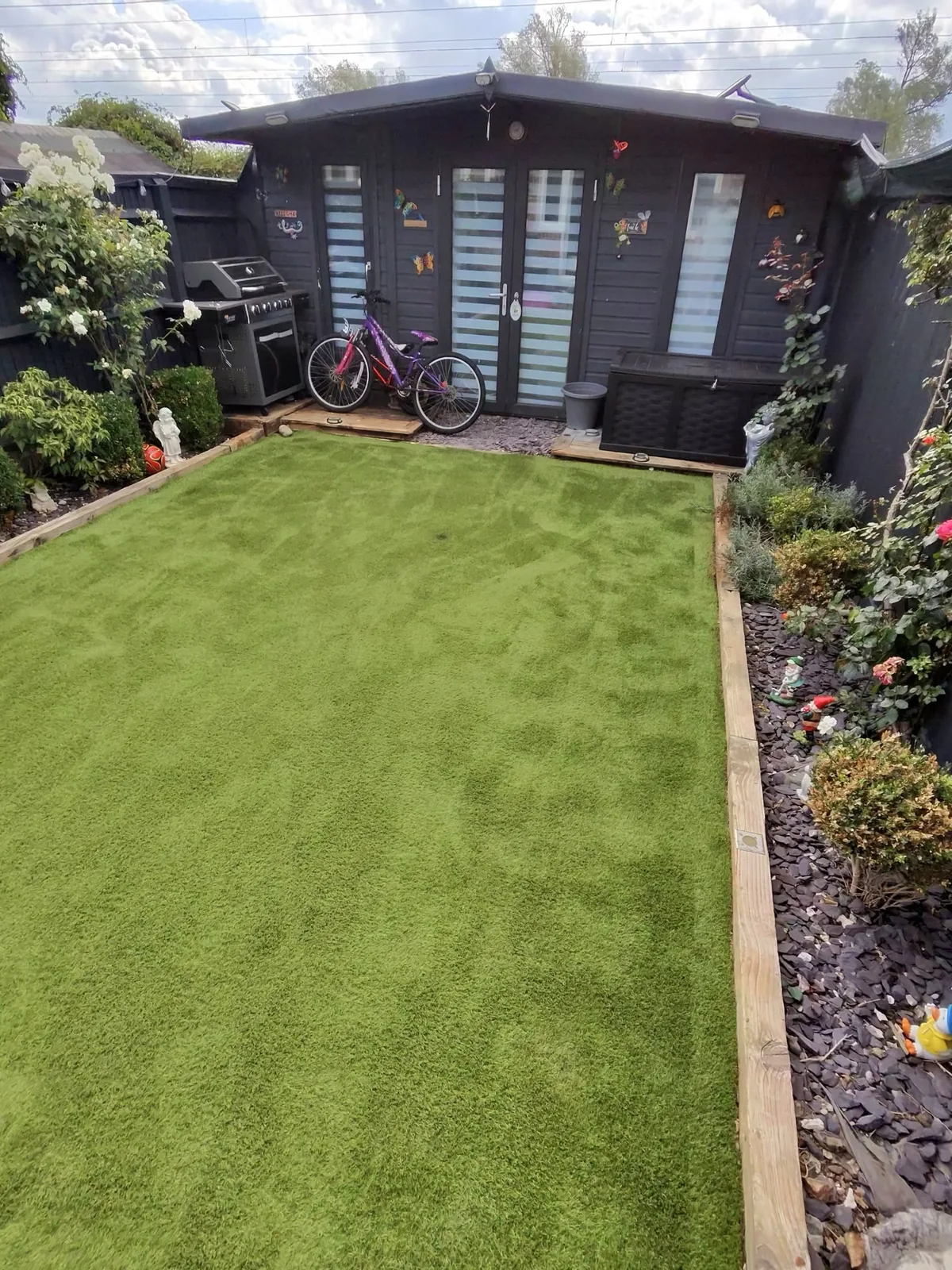 Artificial grass after professional cleaning — fibres upright and vibrant