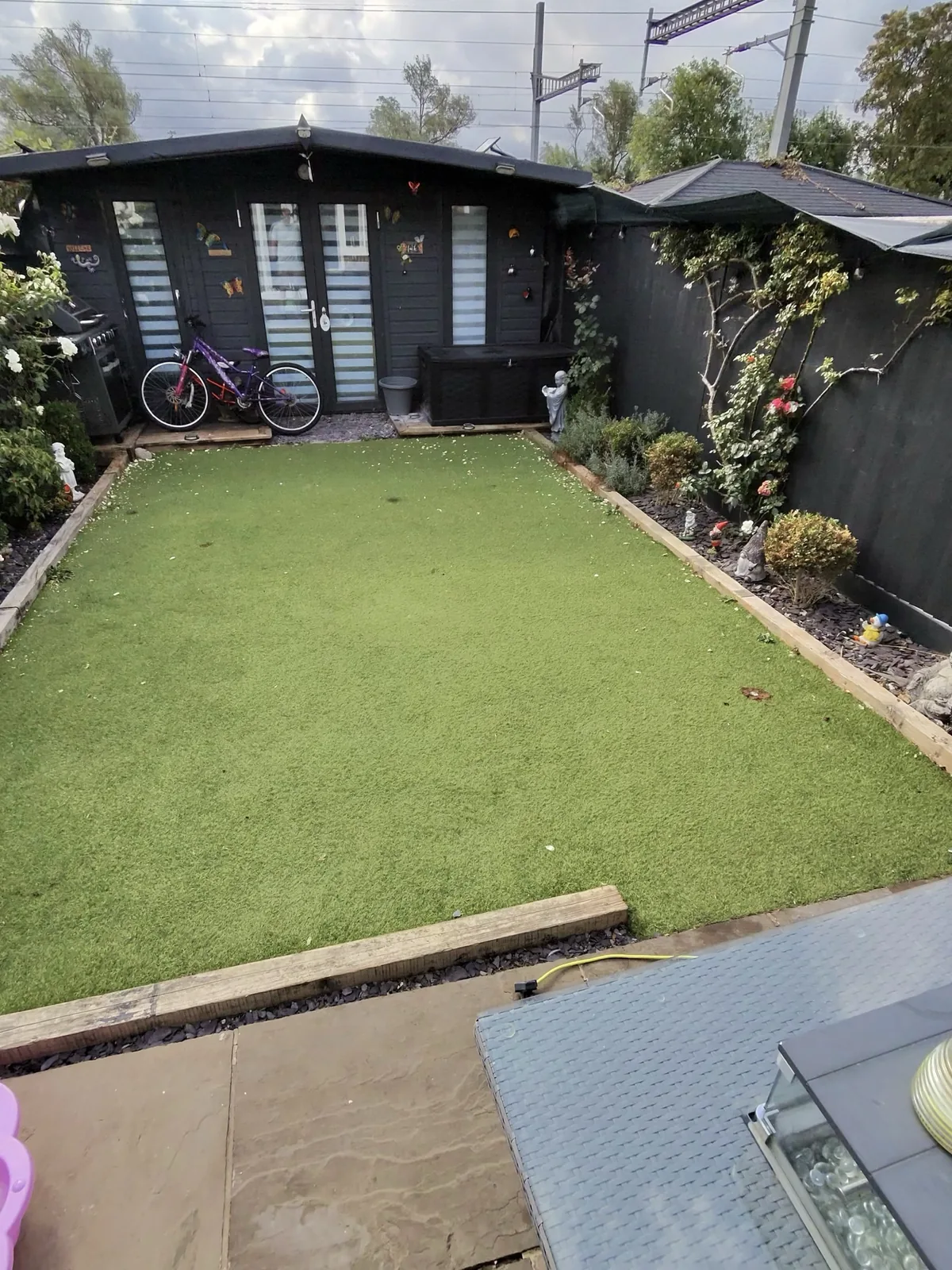 Artificial grass before professional cleaning — flattened pile and debris