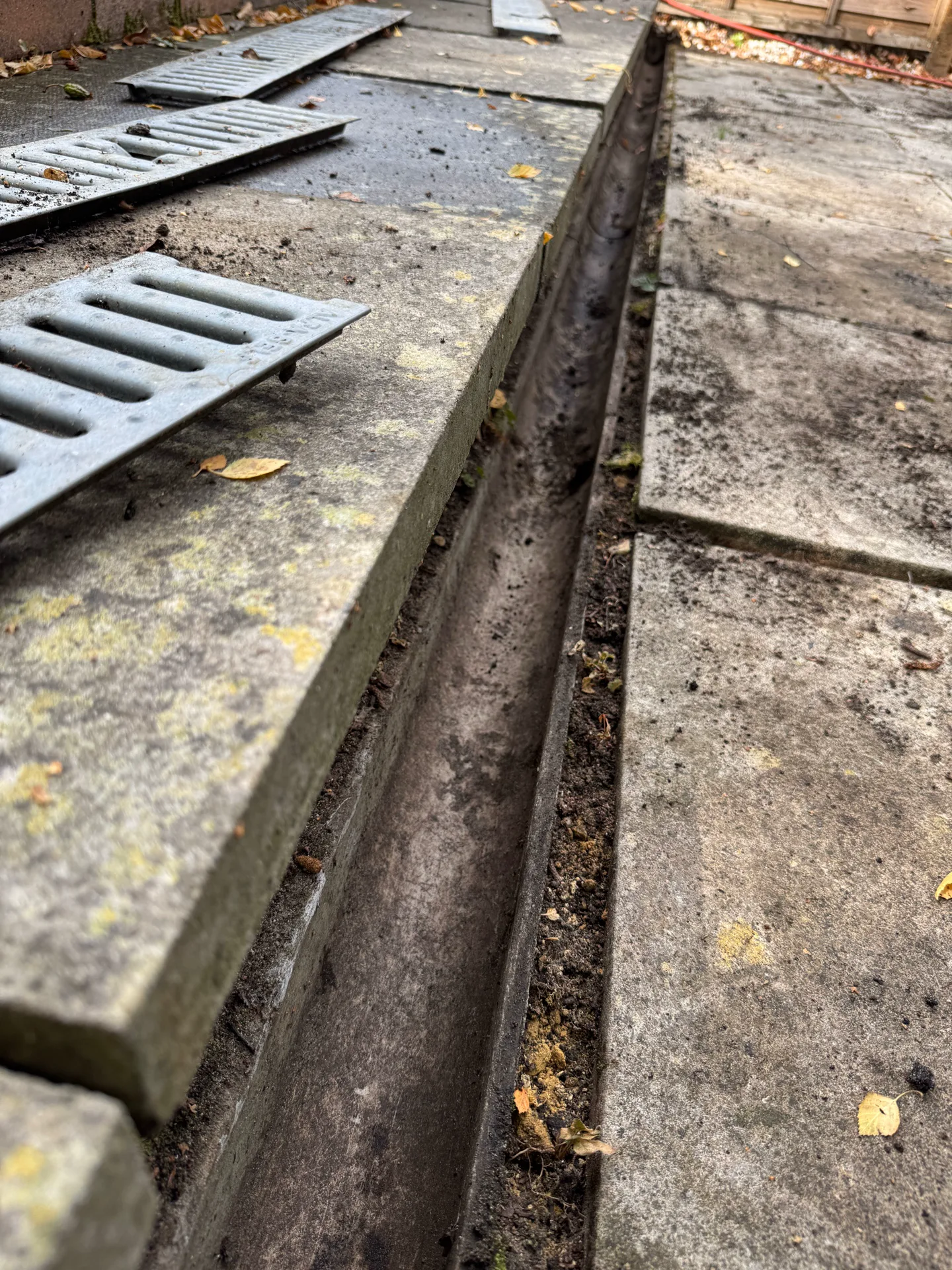 Patio drainage channel cleared during an exterior cleaning job in Northcott, Bracknell