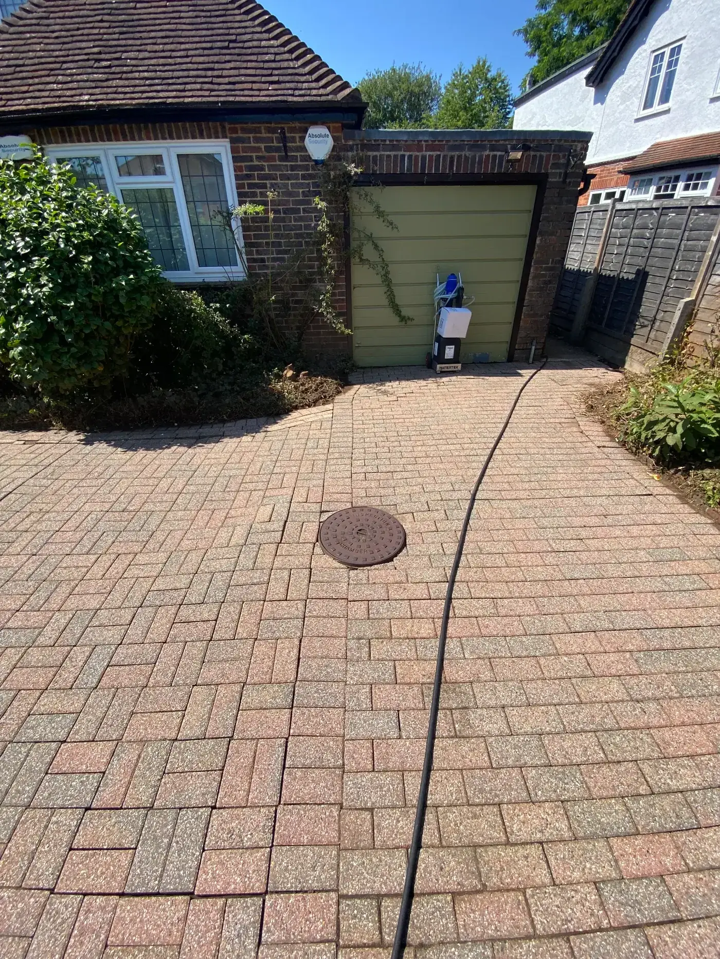 Driveway after cleaning — weeds removed, fully clean