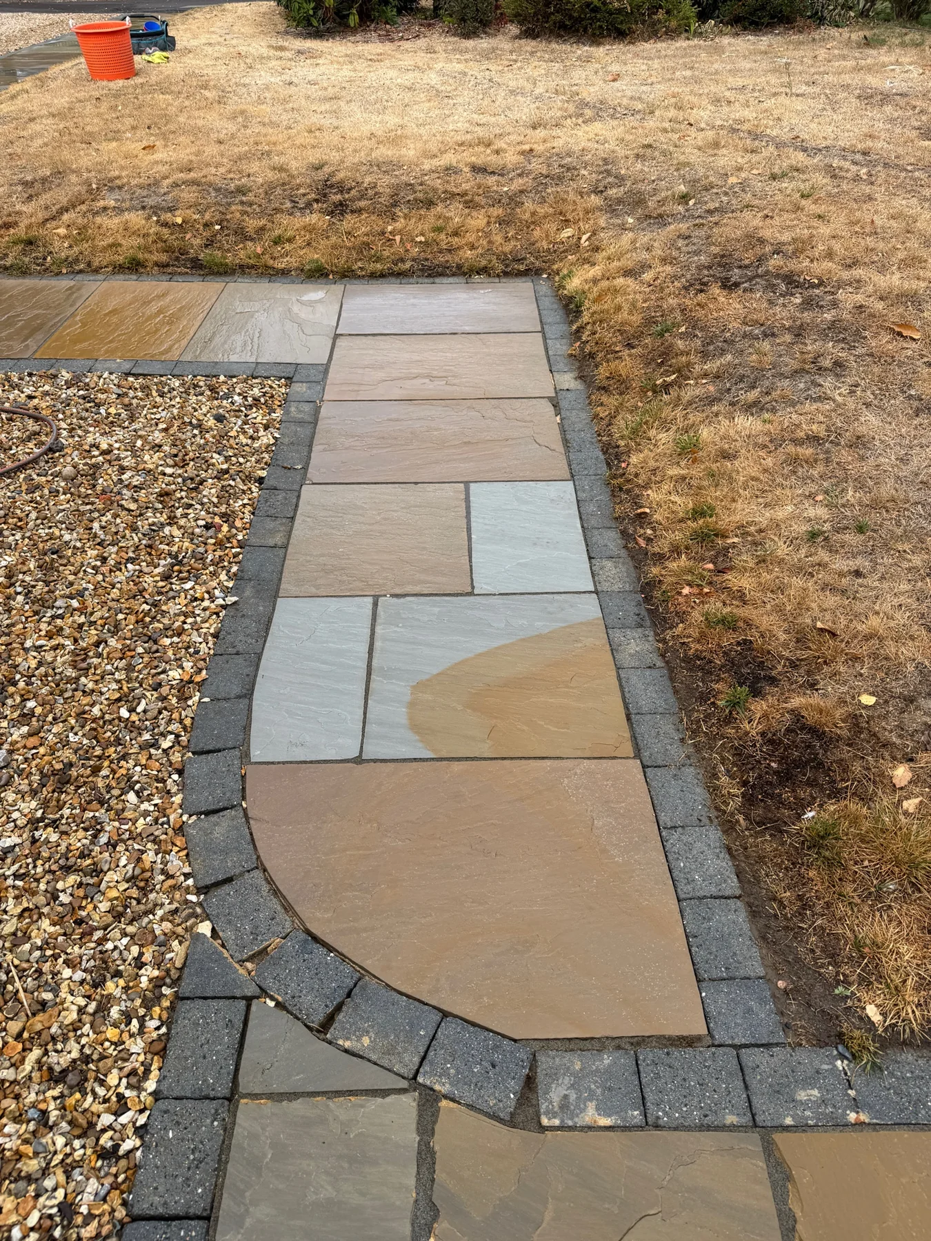Stone patio path in Winkfield Row after pressure washing and professional treatment
