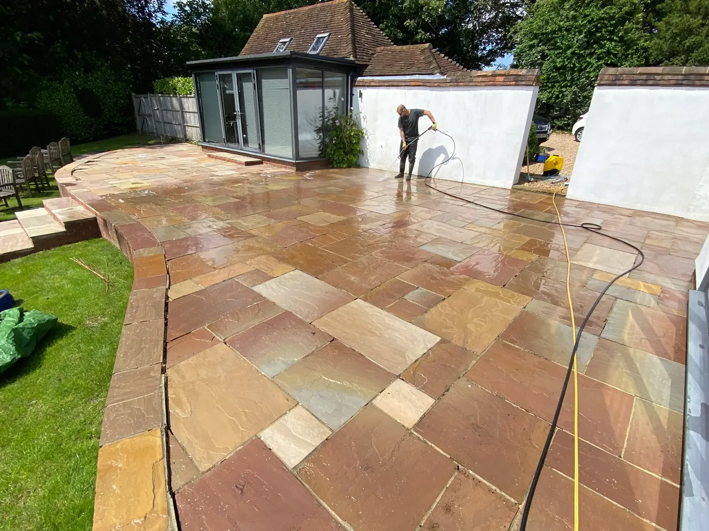 Professional pressure washing a large Indian sandstone patio in Berkshire — PowerJ Exterior Cleaning